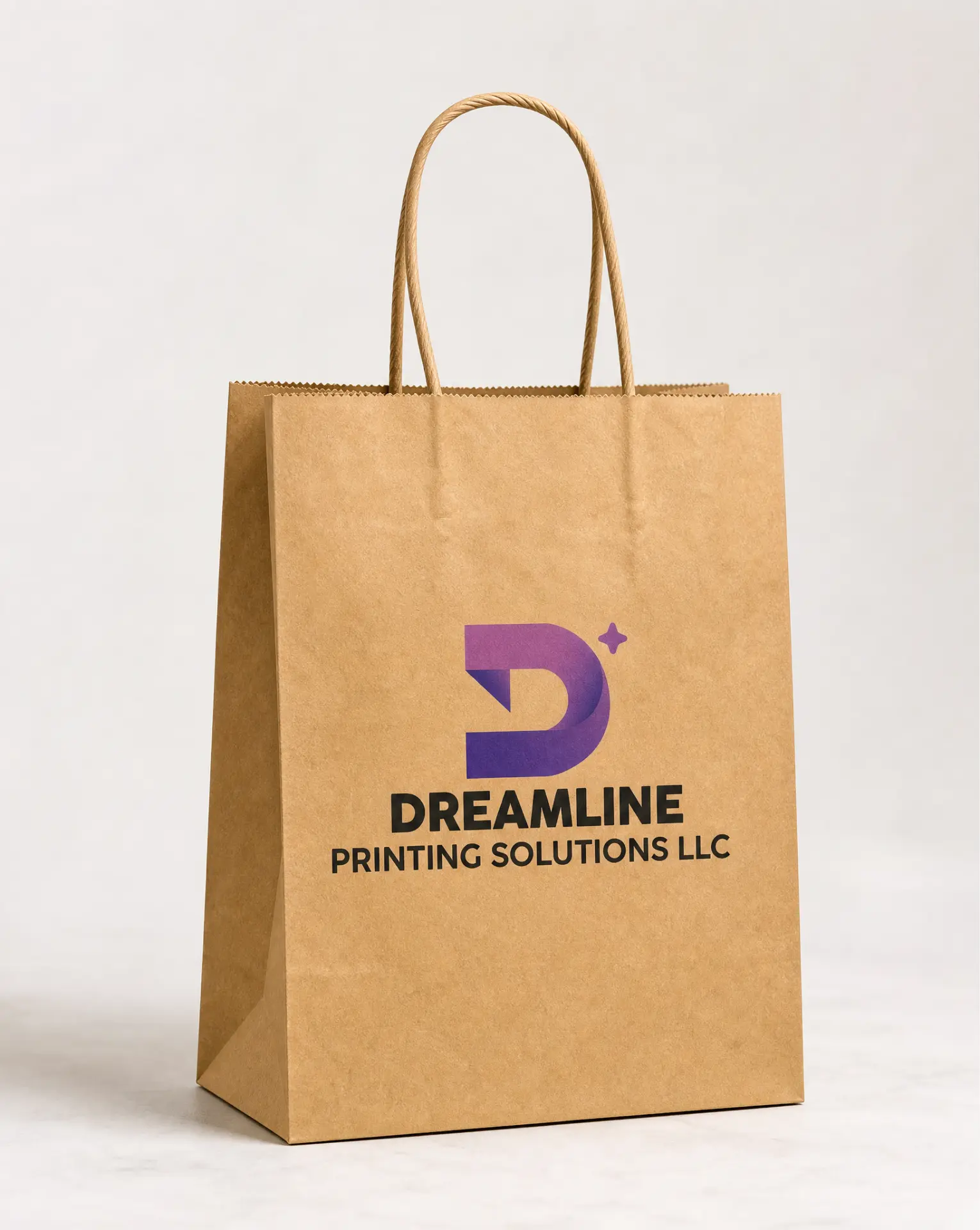 Kraft paper bag with twisted handles printed with the Dreamline Printing Solutions logo