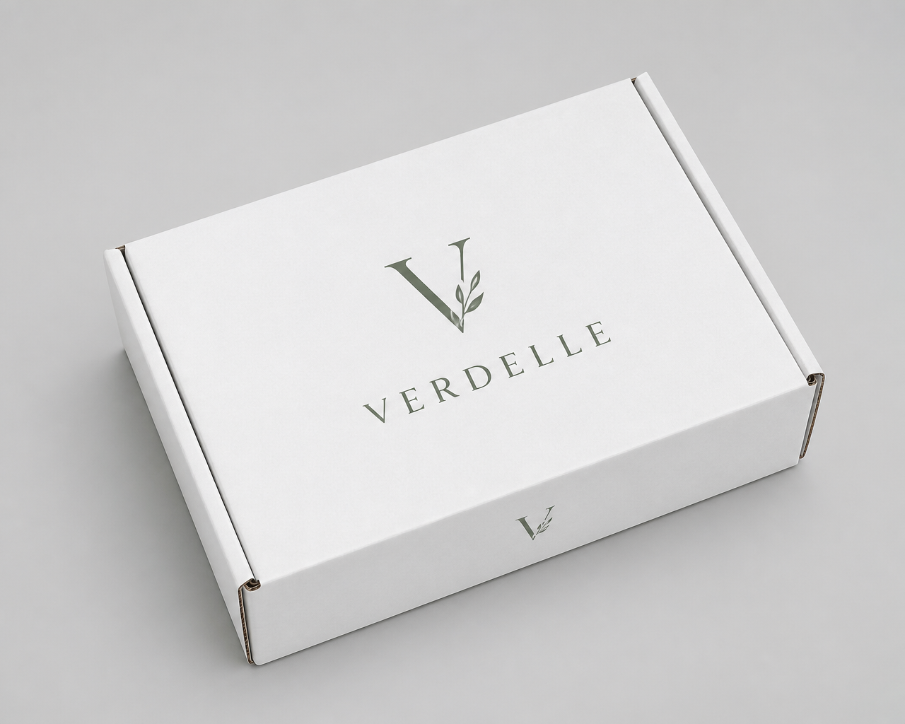White corrugated mailer box printed with an elegant boutique brand logo