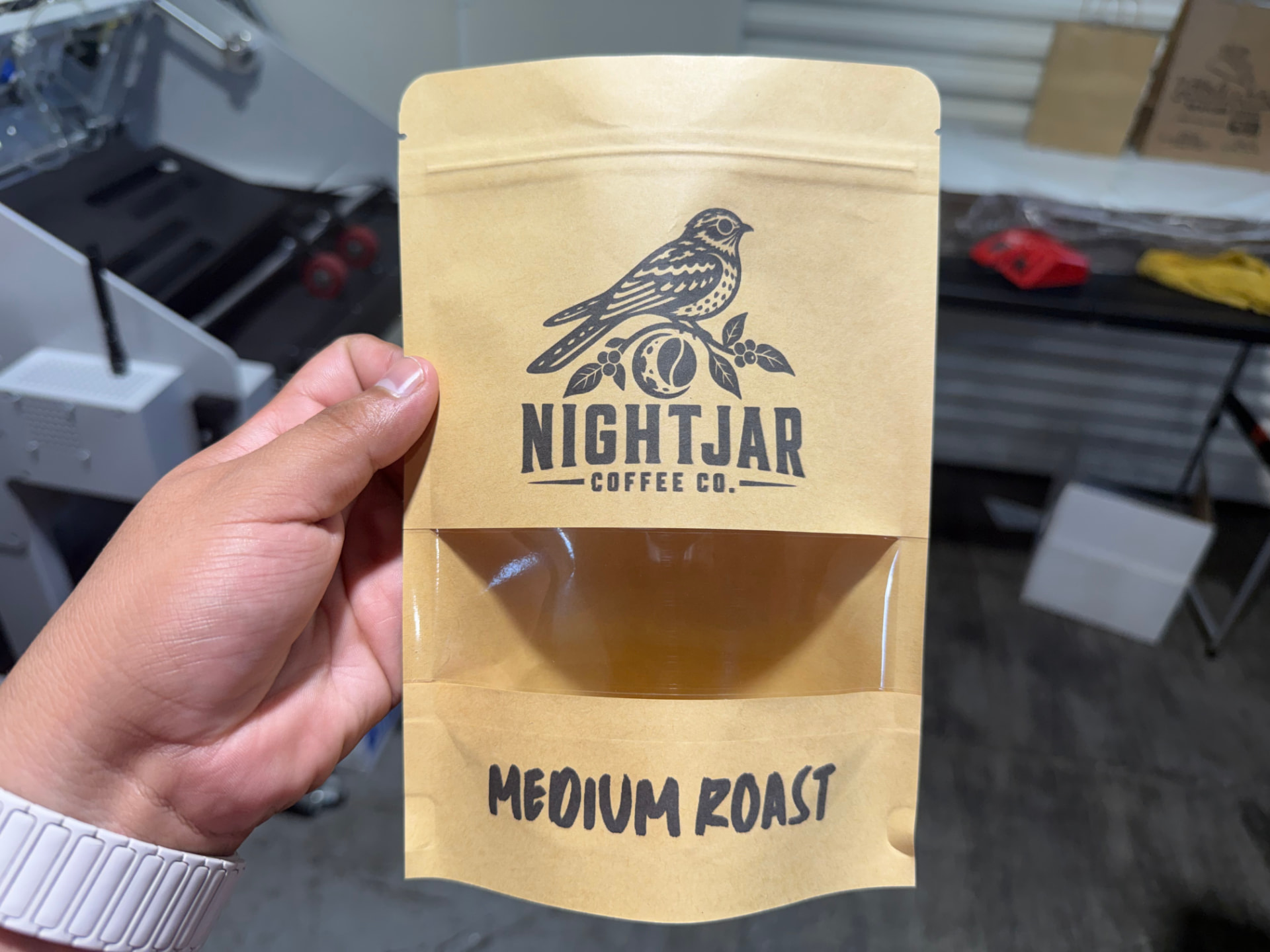 Kraft window pouch printed with a coffee roaster logo and roast level