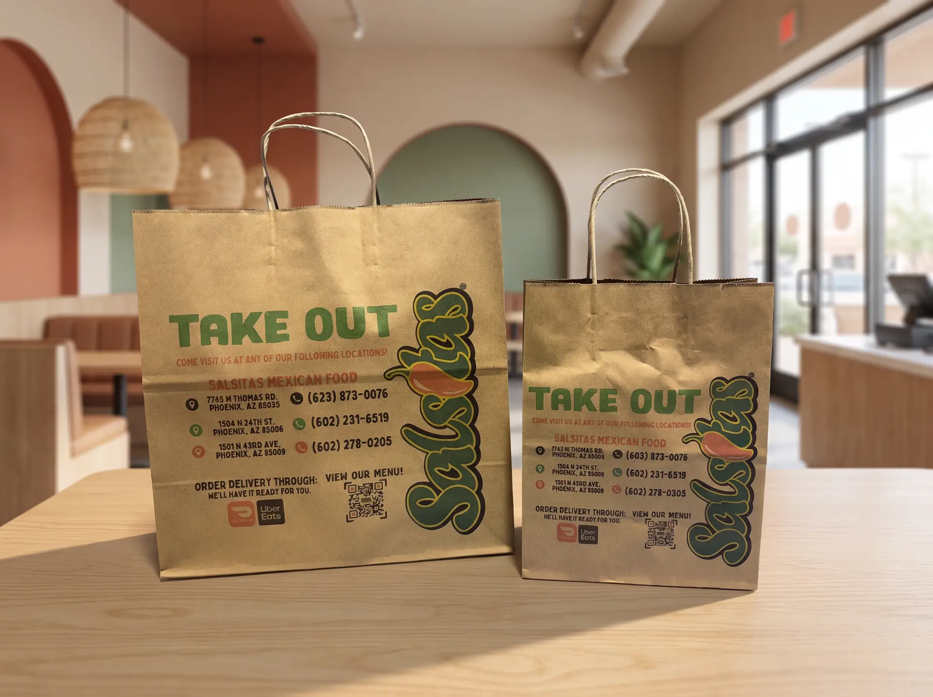 Custom printed kraft takeout bags for a local restaurant with a menu QR code