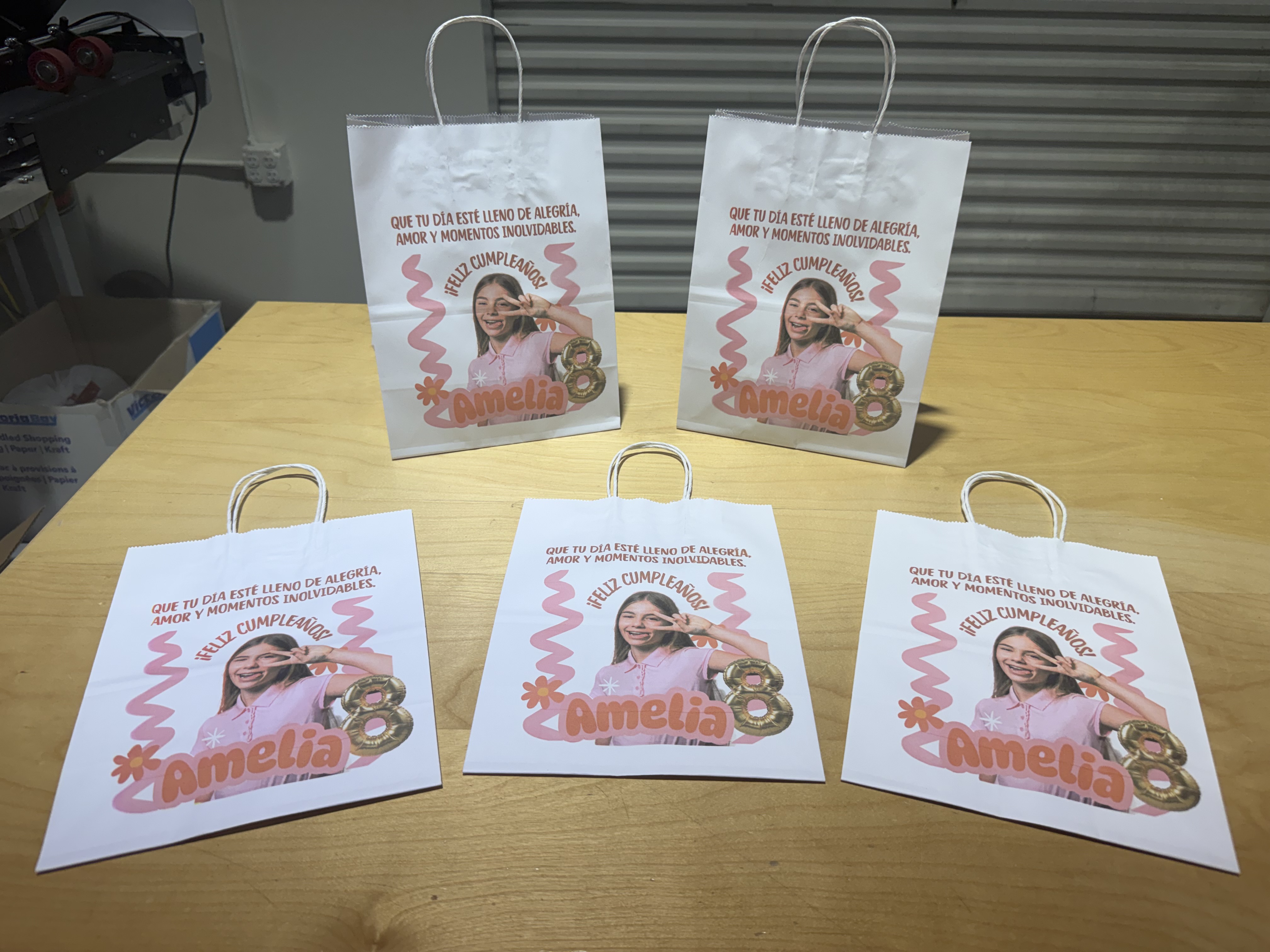 Personalized birthday favor bags printed with a photo and name